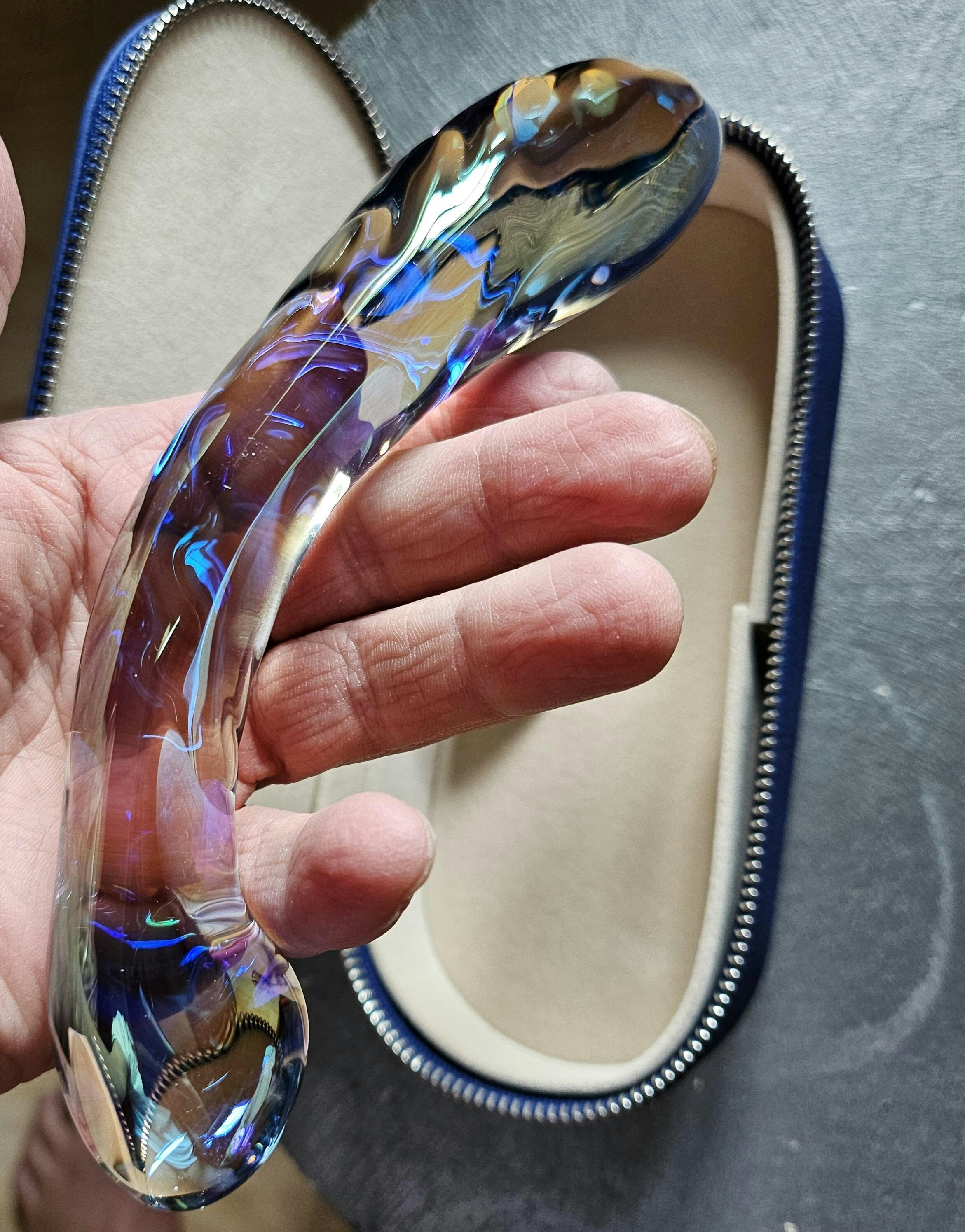 A real customer's photograph of Kalii against bedding.